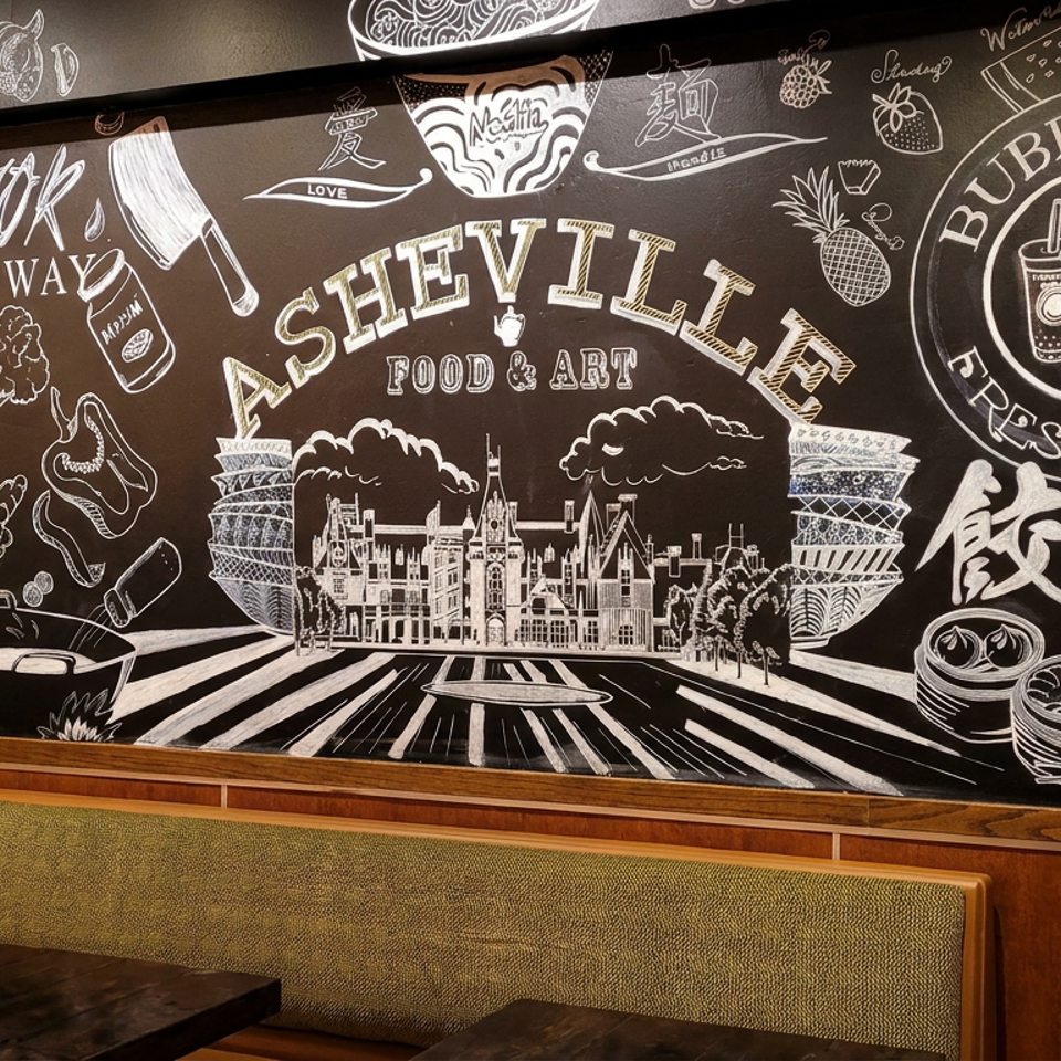 Chalk mural at a restaurant depicts Asian food, bubble tea, London landmarks, and Seville Food & Art branding above booth seating.
